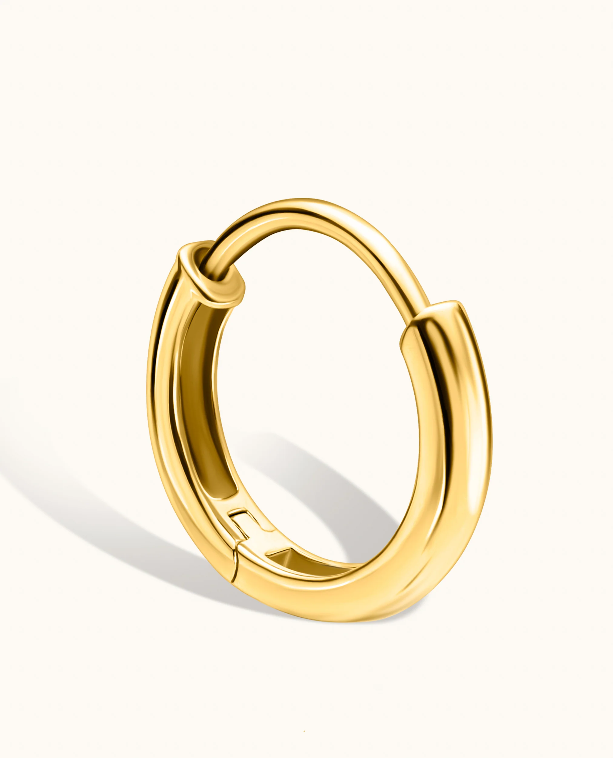 Gold Huggie Earrings - Image 7